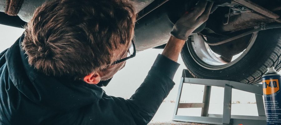 Mechanic assessing auto repair cost
